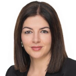 Image of Elisabeth Aleman; dark shoulder-length hair wearing a black blazer