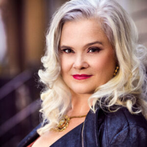 Image of Julie Reyburn; a woman with blond shoulder lenght hair.